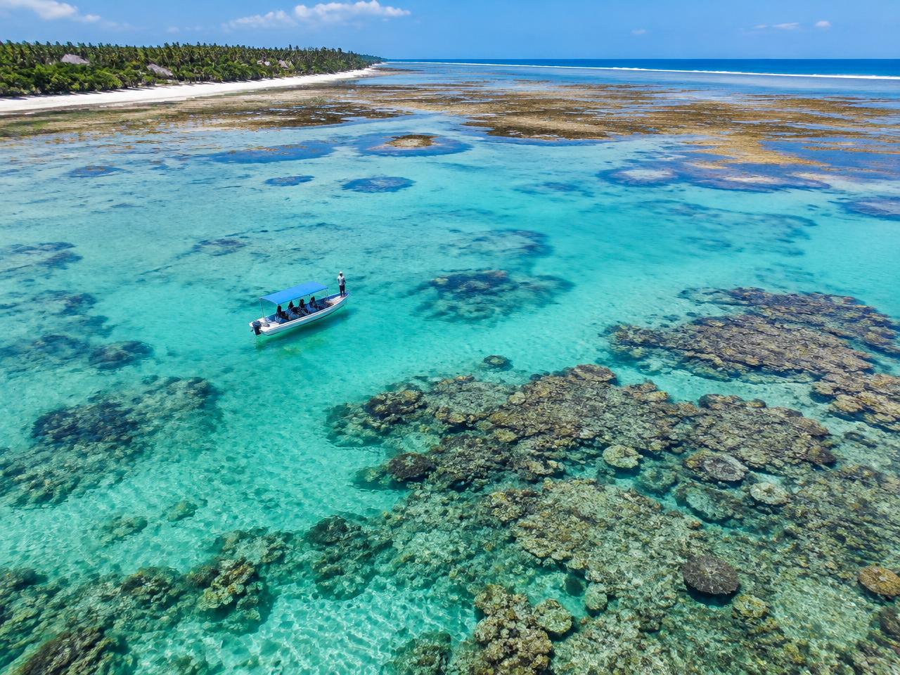 Diani lagoon reef with a guide boat